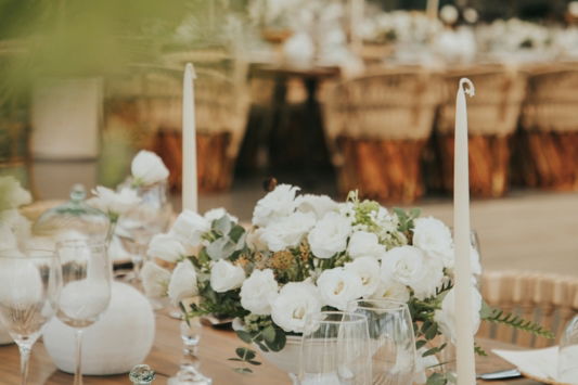 a-table-with-white-flowers-and-candles.jpg a table with white flowers and candles